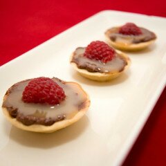 Teeny Tiny Dark Chocolate Cheesecakes with Cajeta and Raspberries