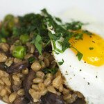 Wheat Berry Risotto with Mushrooms and Peas and Topped with an Egg