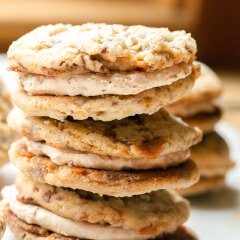 These chewy cookies are full of Butterfingers and stuffed with peanut butter buttercream; it's basically salty-sweet perfection | www.spachethespatula.com #recipe