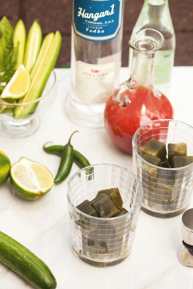 These are not your typical Bloody Marys! Spicy green ice cubes, cucumber soda, and @Hangar1Vodka make these unique! And did I mention super easy to make? | www.spachethespatula.com #recipe #Hangar1Vodka