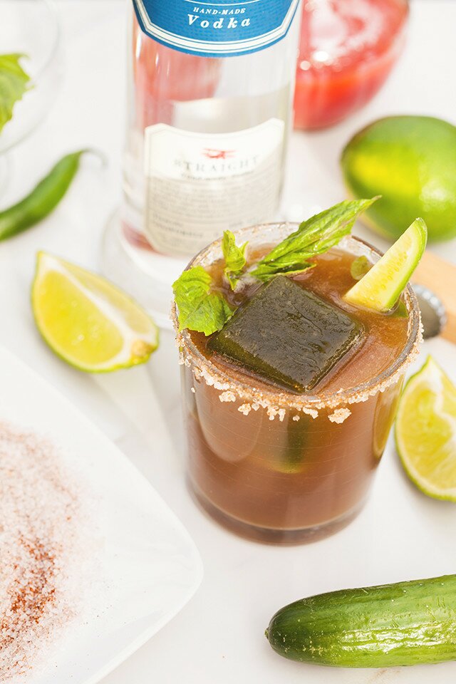 These are not your typical Bloody Marys! Spicy green ice cubes, cucumber soda, and @Hangar1Vodka make these unique! And did I mention super easy to make? | www.spachethespatula.com #recipe #Hangar1Vodka