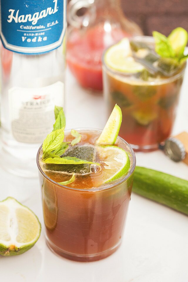 These are not your typical Bloody Marys! Spicy green ice cubes, cucumber soda, and @Hangar1Vodka make these unique! And did I mention super easy to make? | www.spachethespatula.com #recipe #Hangar1Vodka