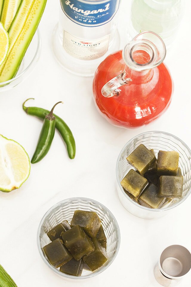 These are not your typical Bloody Marys! Spicy green ice cubes, cucumber soda, and @Hangar1Vodka make these unique! And did I mention super easy to make? | www.spachethespatula.com #recipe #Hangar1Vodka