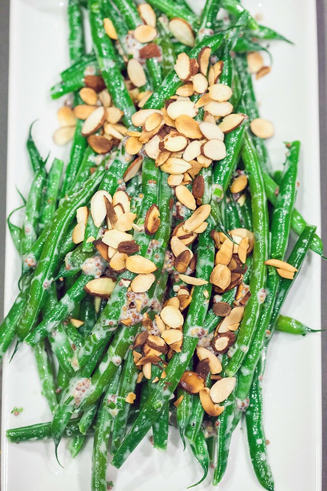 Crisp green beans are coated with a creamy, herby, whole grain mustard sauce, and topped with crunchy toasted almonds, and ready in 5 minutes! | www.spachethespatula.com #recipe