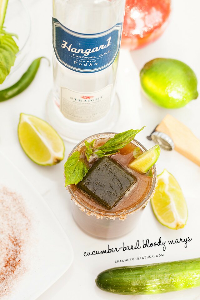 These are not your typical Bloody Marys! Spicy green ice cubes, cucumber soda, and @Hangar1Vodka make these unique! And did I mention super easy to make? | www.spachethespatula.com #recipe #Hangar1Vodka