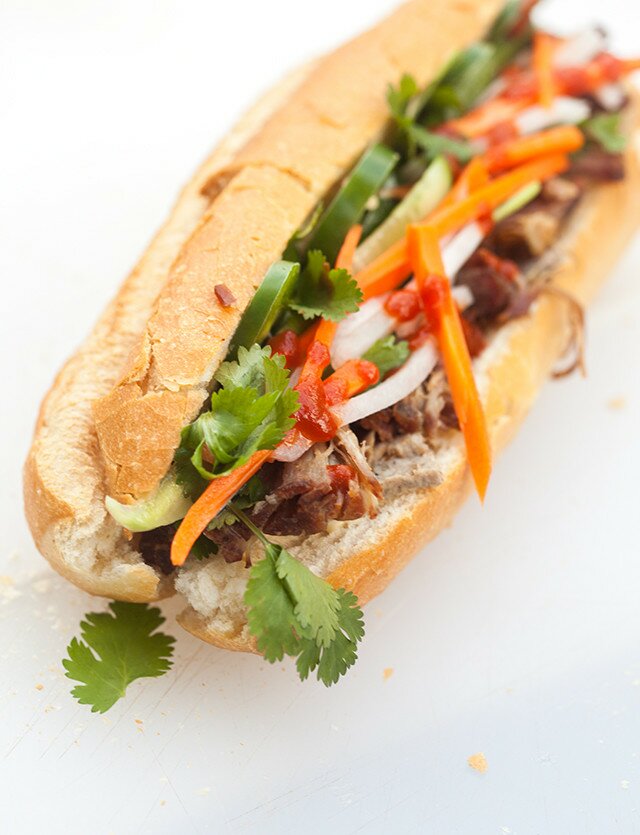 This outrageously delicious Vietnamese sandwich contains succulent roast pork shoulder, pork pâté, and homemade pickles! | www.spachethespatula.com #recipe