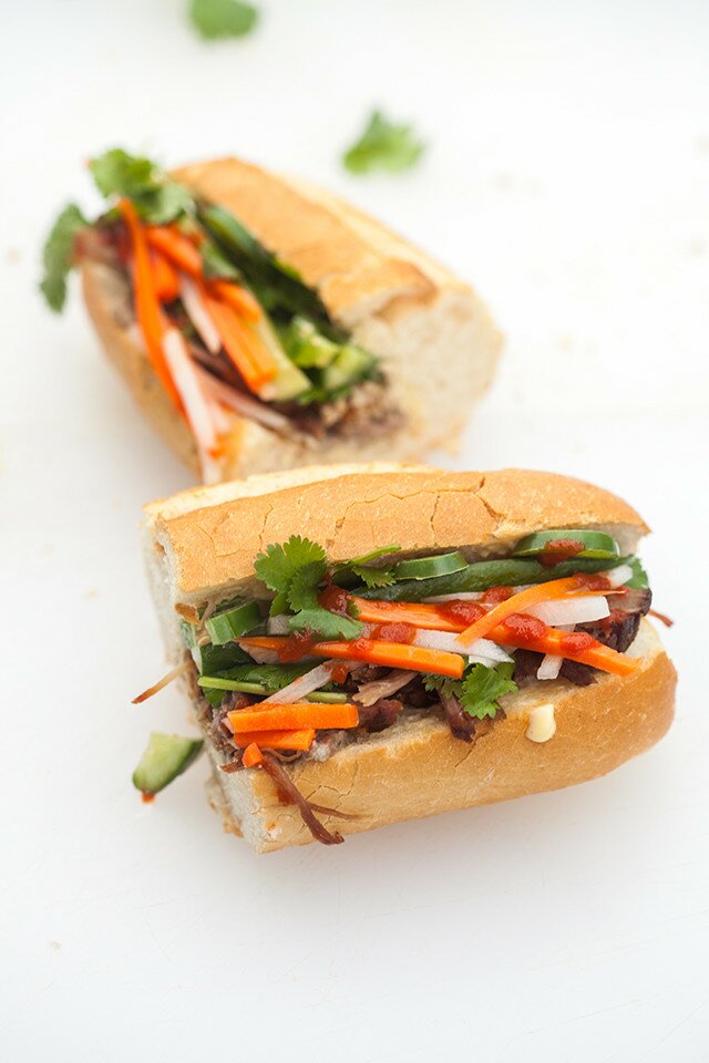 This outrageously delicious Vietnamese sandwich contains succulent roast pork shoulder, pork pâté, and homemade pickles! | www.spachethespatula.com #recipe