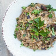 A secret ingredient packs a wallop of mushroom flavor into the creamy, decadent dish. It's the BEST mushroom risotto I've ever tried! | www.spachethespatula.com #recipe