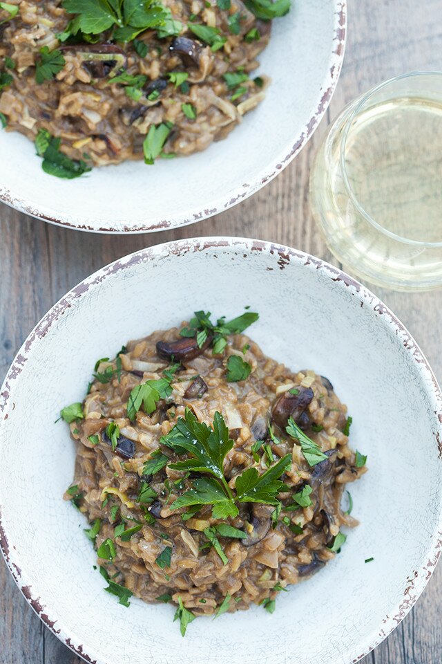 A secret ingredient packs a wallop of mushroom flavor into the creamy, decadent dish. It's the BEST mushroom risotto I've ever tried! | www.spachethespatula.com #recipe