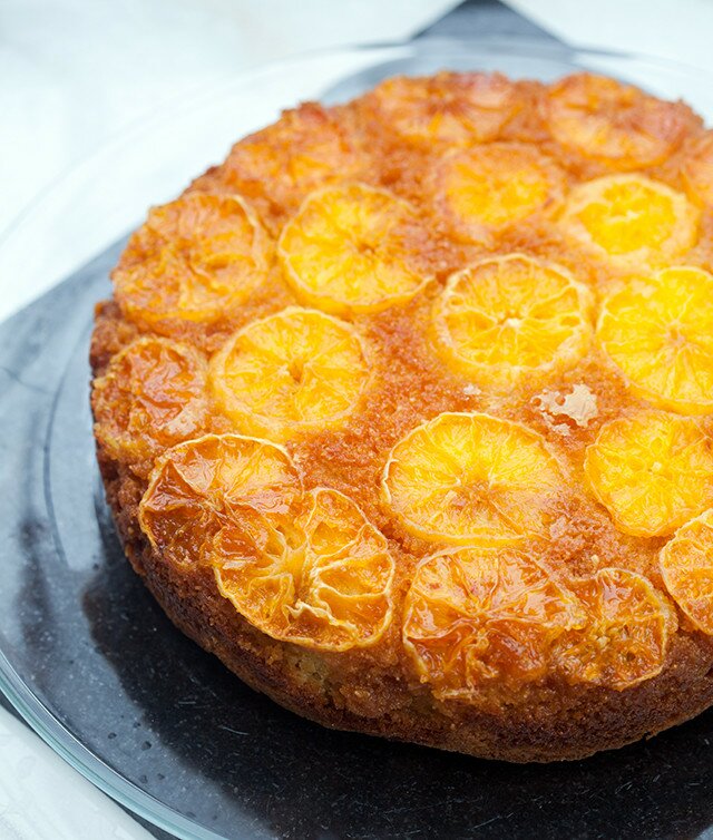 This moist and fluffy cake has a crunchy toasted cinnamon almond base, and a gooey tangelo and caramel top---it’s outrageously tasty as dessert, or breakfast! | www.spachethespatula.com #recipe