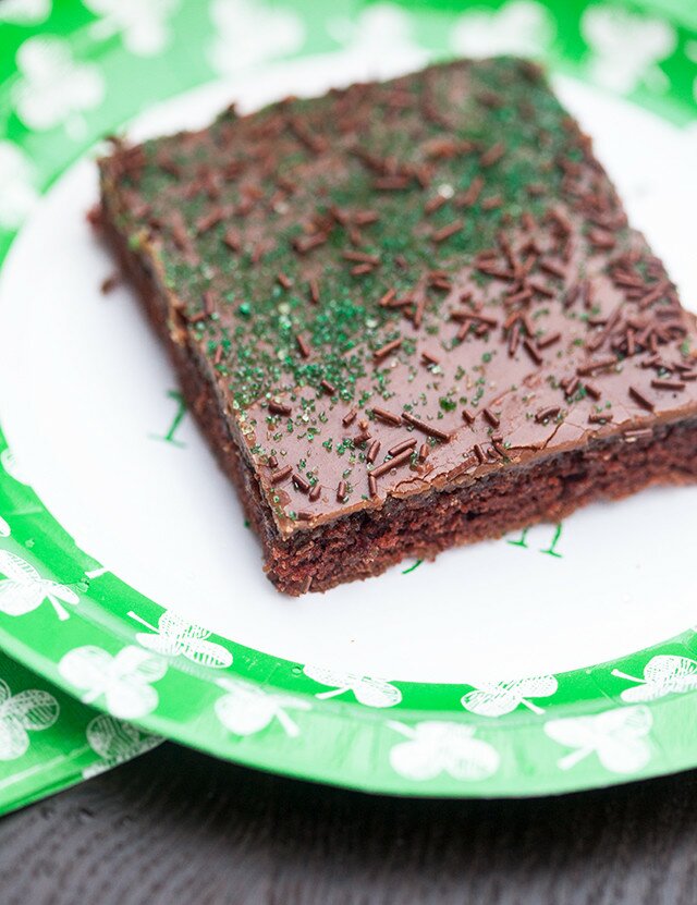 The moistest chocolate sheet cake with creamy chocolate icing, spiked with Guinness beer---this is the BEST sheet cake you will ever try! | www.spachethespatula.com #recipe