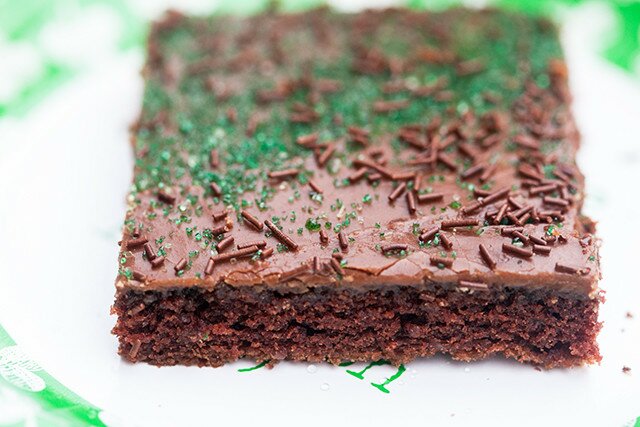 The moistest chocolate sheet cake with creamy chocolate icing, spiked with Guinness beer---this is the BEST sheet cake you will ever try! | www.spachethespatula.com #recipe