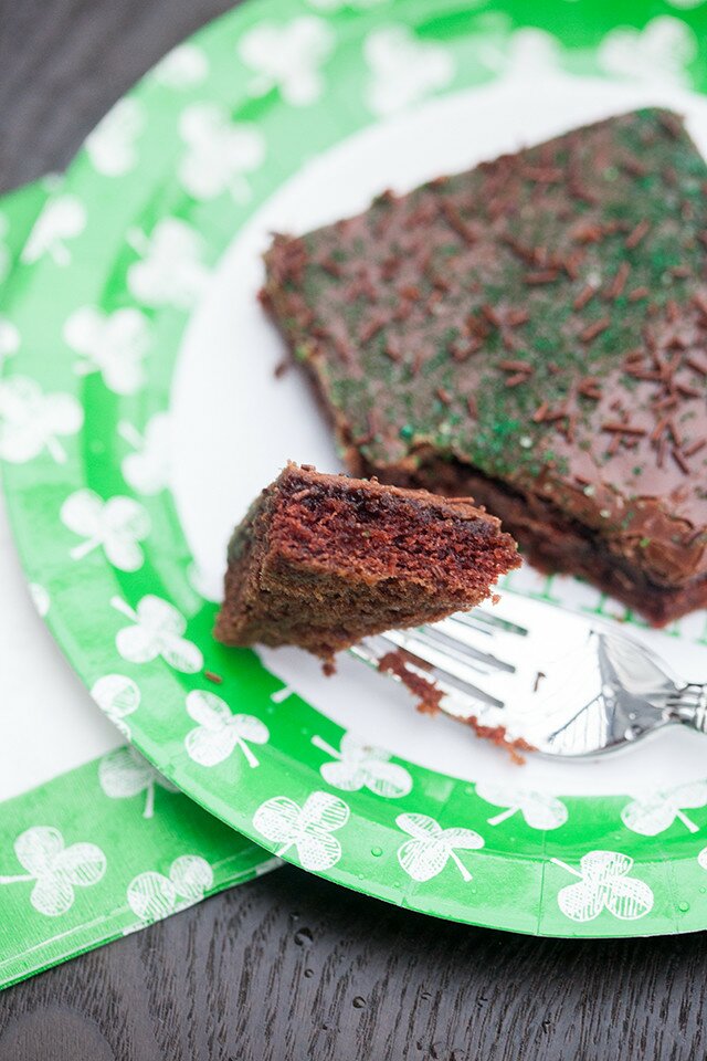 The moistest chocolate sheet cake with creamy chocolate icing, spiked with Guinness beer---this is the BEST sheet cake you will ever try! | www.spachethespatula.com #recipe