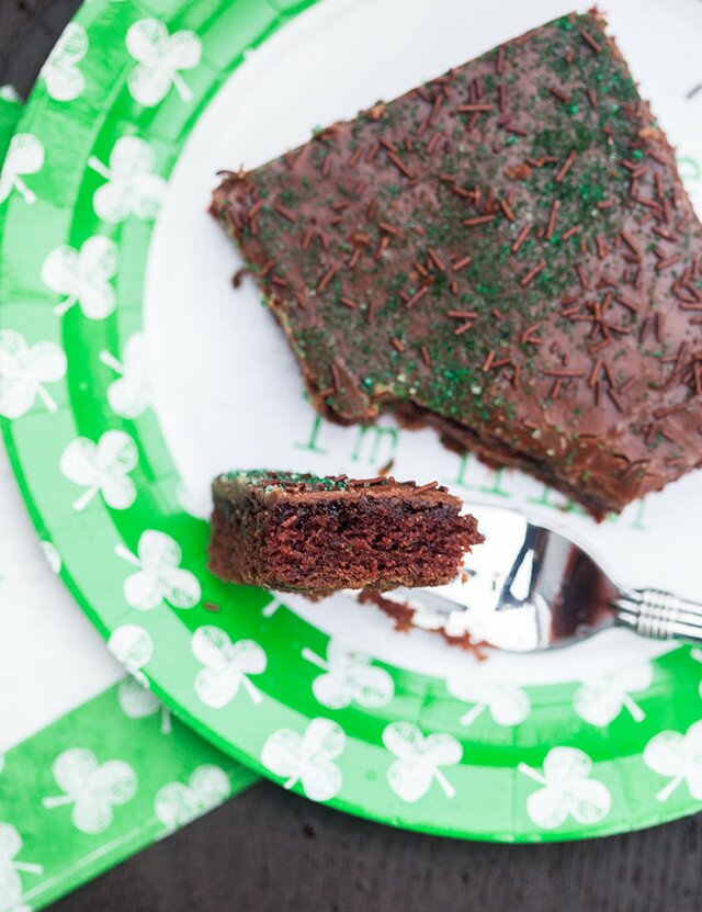 The moistest chocolate sheet cake with creamy chocolate icing, spiked with Guinness beer---this is the BEST sheet cake you will ever try! | www.spachethespatula.com #recipe