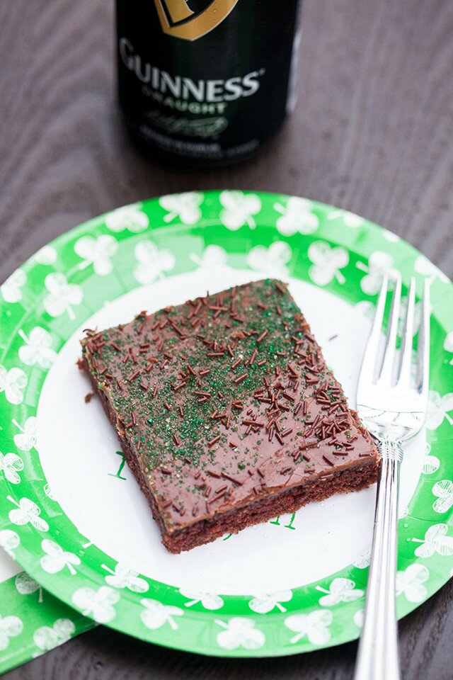 The moistest chocolate sheet cake with creamy chocolate icing, spiked with Guinness beer---this is the BEST sheet cake you will ever try! | www.spachethespatula.com #recipe