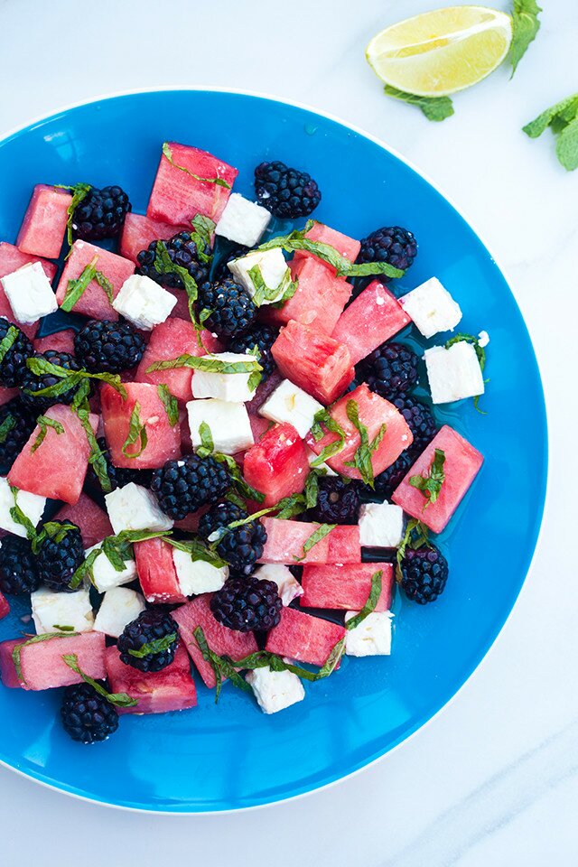 Refreshing fruit, salty feta, and tangy-sweet dressing---this is a perfect salad for warmer weather! | www.spachethespatula.com #recipe