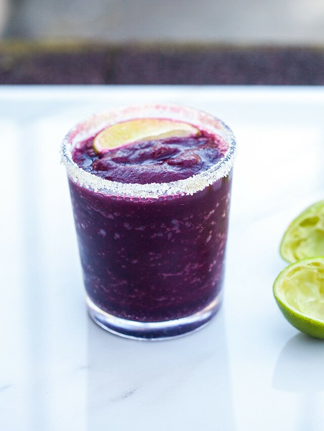 Blueberries, lime, and just a touch of agave combine for a gorgeous and delicious margarita! | www.spachethespatula.com #recipe