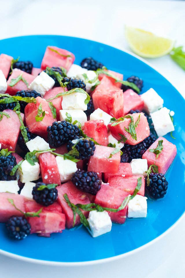 Refreshing fruit, salty feta, and tangy-sweet dressing---this is a perfect salad for warmer weather! | www.spachethespatula.com #recipe