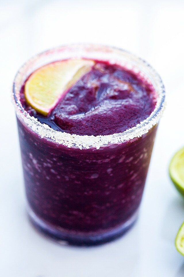 Blueberries, lime, and just a touch of agave combine for a gorgeous and delicious margarita! | www.spachethespatula.com #recipe