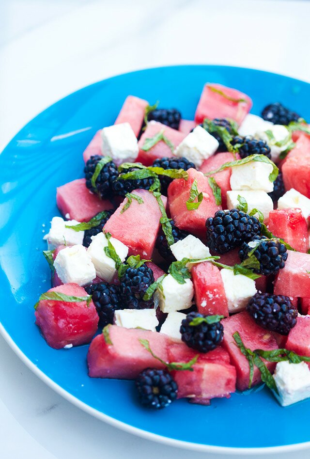 Refreshing fruit, salty feta, and tangy-sweet dressing---this is a perfect salad for warmer weather! | www.spachethespatula.com #recipe