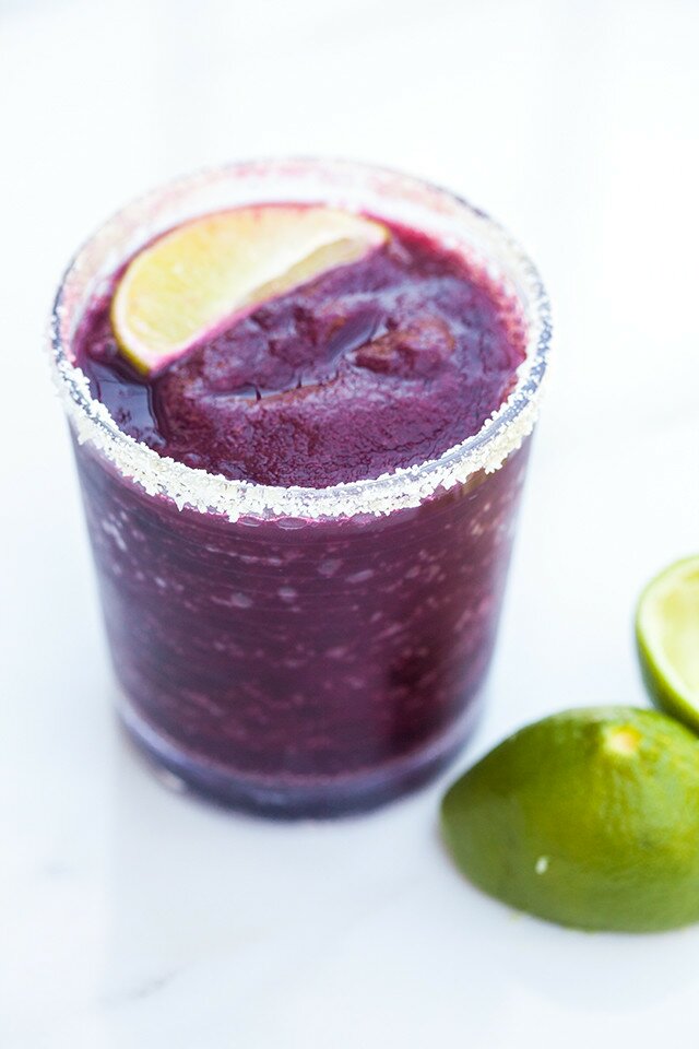 Blueberries, lime, and just a touch of agave combine for a gorgeous and delicious margarita! | www.spachethespatula.com #recipe