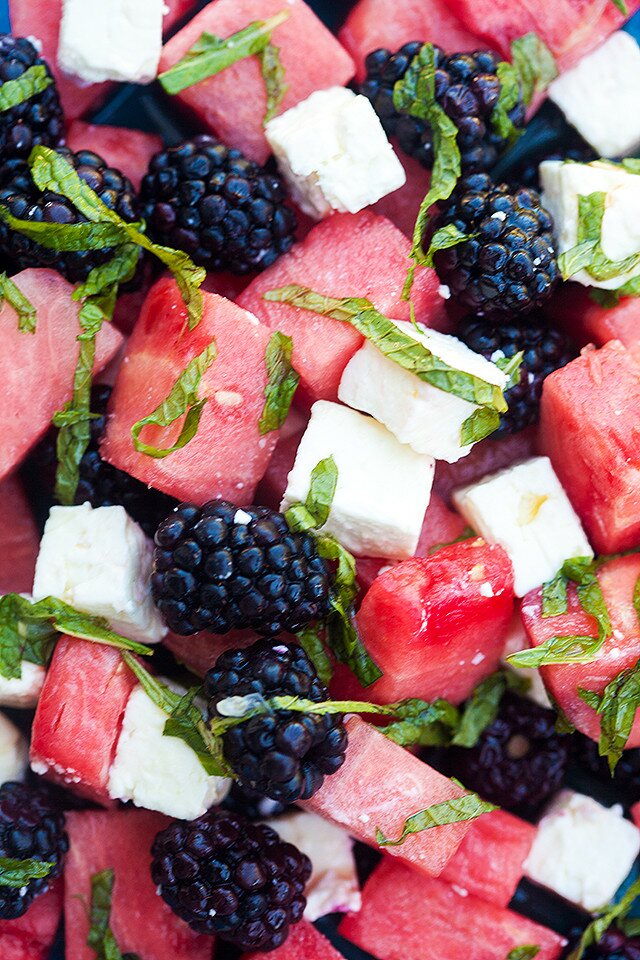 Refreshing fruit, salty feta, and tangy-sweet dressing---this is a perfect salad for warmer weather! | www.spachethespatula.com #recipe