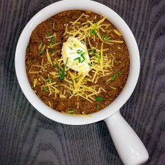 An all meat (no beans!) chili PERFECT for topping hot dogs, baked potatoes, fries, or anything else! | www.spachethespatula.com #recipe