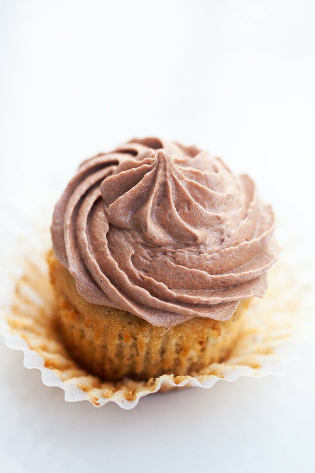 Moist and delicious banana cake topped with a soft and fluffy Nutella cream cheese buttercream---the BEST use for brown bananas! | www.spachethespatula.com #recipe