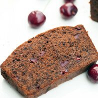 A dense, rich, and chocolatey pound cake, studded with pieces of fresh, juicy cherries! | www.spachethespatula.com #recipe