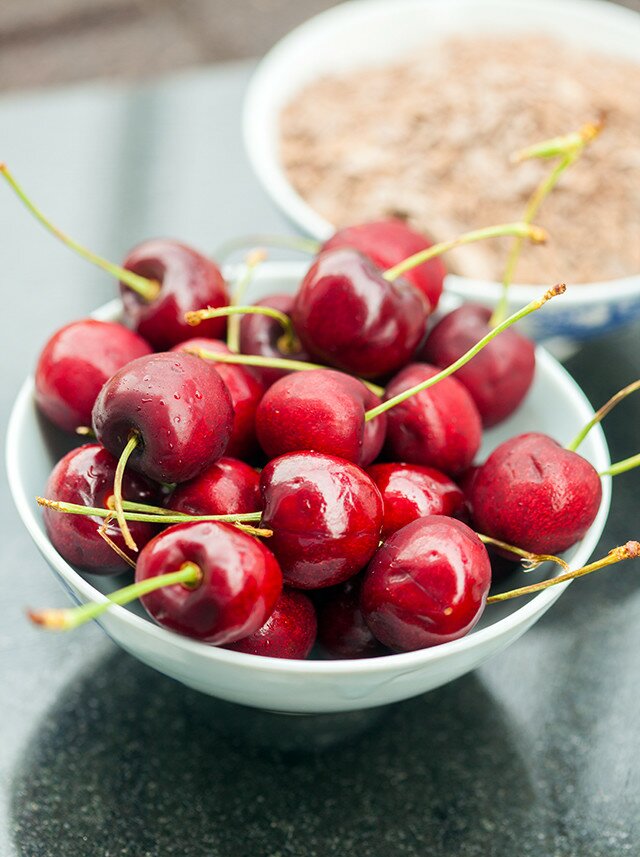 A dense, rich, and chocolatey pound cake, studded with pieces of fresh, juicy cherries! | www.spachethespatula.com #recipe