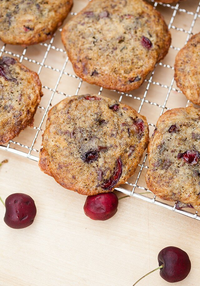 Chewy cookies filled with pieces of fresh, juicy cherries, and studded with bittersweet chocolate | www.spachethespatula.com #recipe