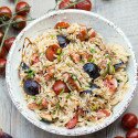 Juicy tomatoes, sweet figs, bold blue cheese, fresh herbs, and crunchy walnuts come together with a sticky drizzle of balsamic glaze, to create a Summer picnic, pasta salad masterpiece. | www.spachethespatula.com #recipe