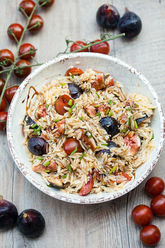 Juicy tomatoes, sweet figs, bold blue cheese, fresh herbs, and crunchy walnuts come together with a sticky drizzle of balsamic glaze, to create a Summer picnic, pasta salad masterpiece. | www.spachethespatula.com #recipe