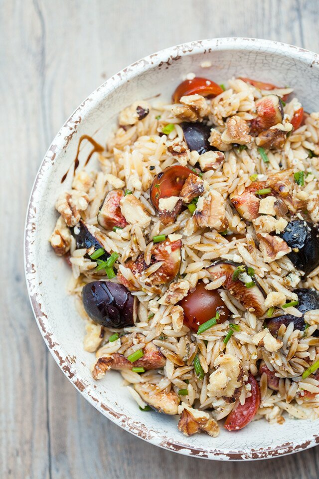 Juicy tomatoes, sweet figs, bold blue cheese, fresh herbs, and crunchy walnuts come together with a sticky drizzle of balsamic glaze, to create a Summer picnic, pasta salad masterpiece. | www.spachethespatula.com #recipe