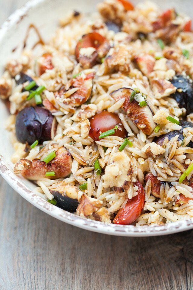 Juicy tomatoes, sweet figs, bold blue cheese, fresh herbs, and crunchy walnuts come together with a sticky drizzle of balsamic glaze, to create a Summer picnic, pasta salad masterpiece. | www.spachethespatula.com #recipe