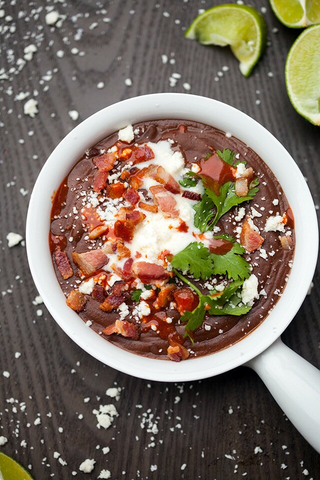 A thick and hearty black bean soup that is totally loaded with toppings! | www.spachethespatula.com #recipe