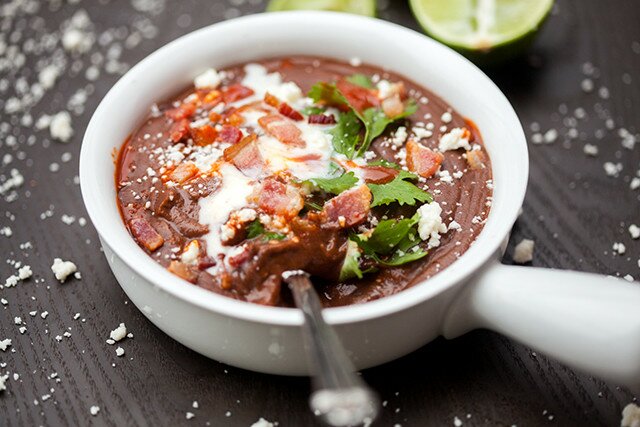 A thick and hearty black bean soup that is totally loaded with toppings! | www.spachethespatula.com #recipe