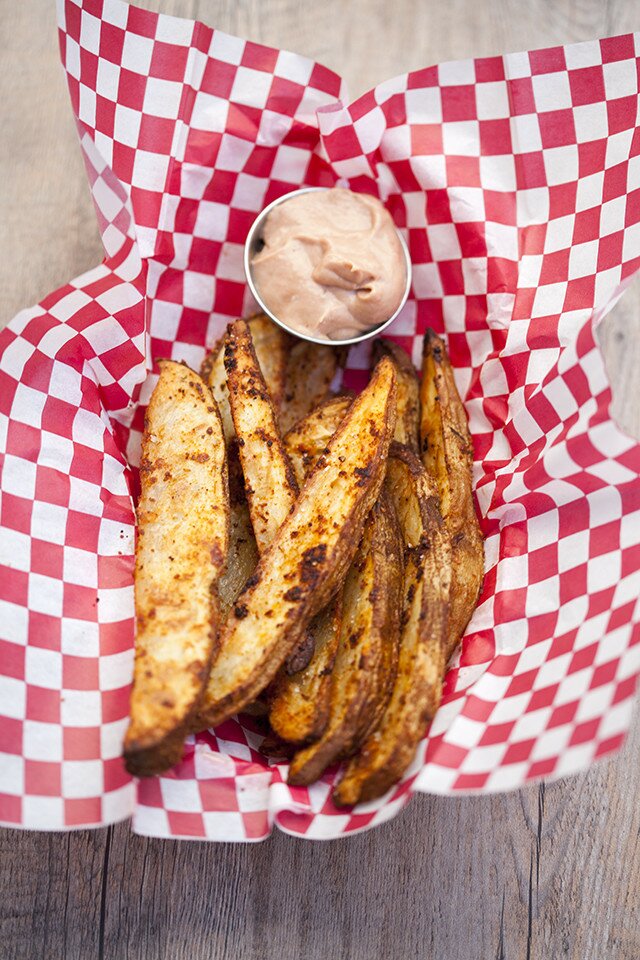 These potato wedges are crazy flavorful on their own, but even better dipped in this barbecue-y sauce! #BeholdPotatoes | www.spachethespatula.com #recipe