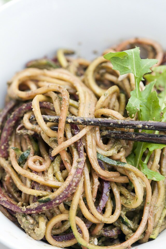 Zucchini and beet noodles tossed in a super flavorful pesto---this salad/noodle dish is so super tasty! #vegan | www.spachethespatula.com #recipe