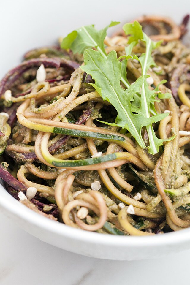 Zucchini and beet noodles tossed in a super flavorful pesto---this salad/noodle dish is so super tasty! #vegan | www.spachethespatula.com #recipe