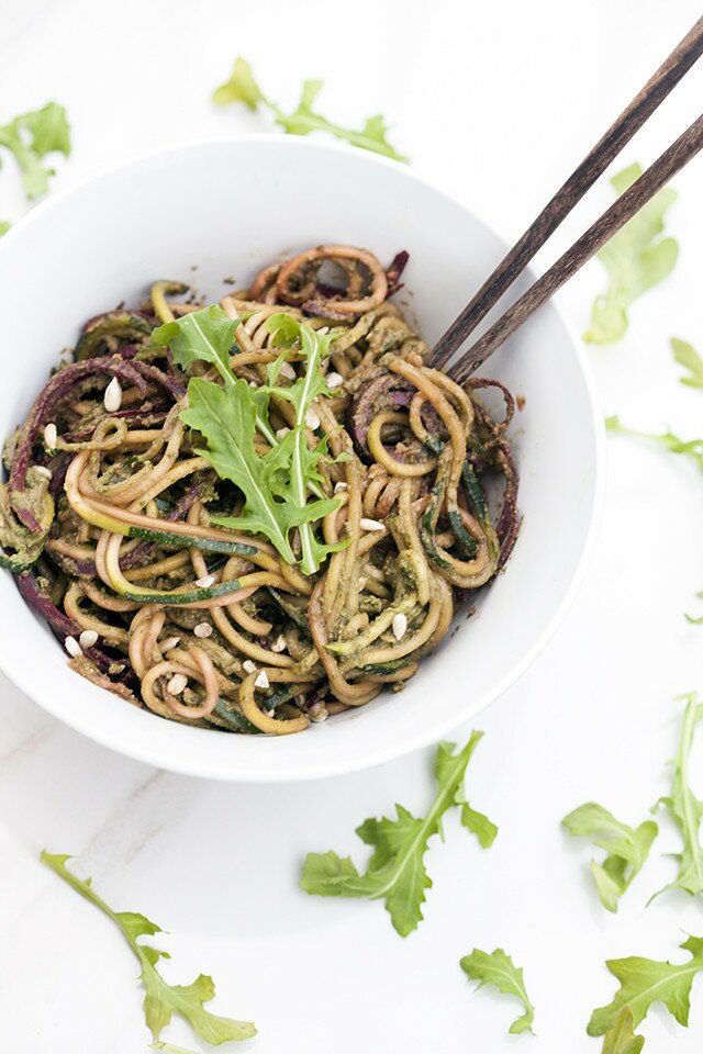 Zucchini and beet noodles tossed in a super flavorful pesto---this salad/noodle dish is so super tasty! #vegan | www.spachethespatula.com #recipe