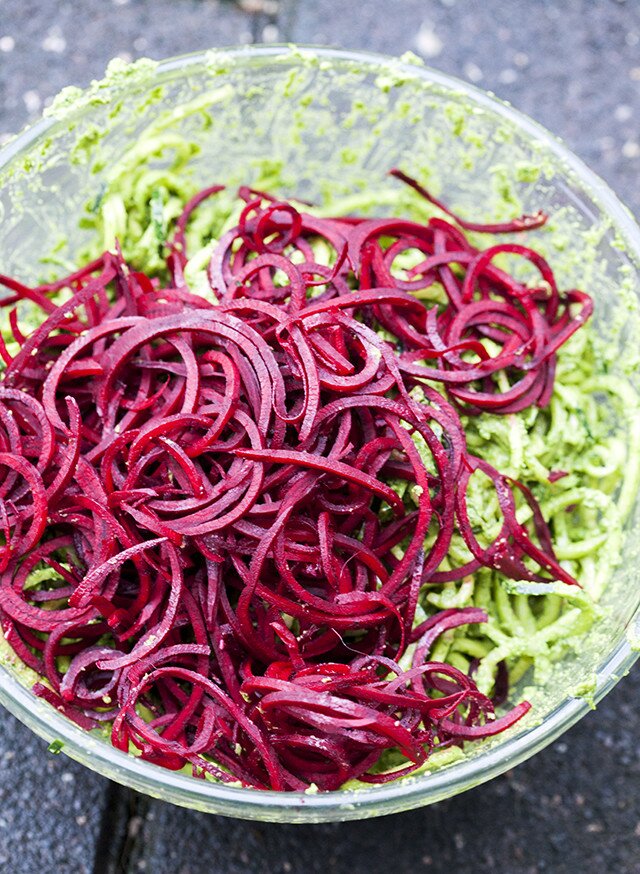 Zucchini and beet noodles tossed in a super flavorful pesto---this salad/noodle dish is so super tasty! #vegan | www.spachethespatula.com #recipe