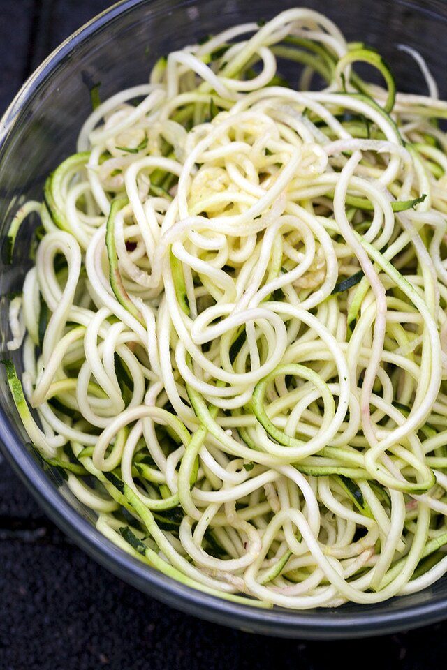 Zucchini and beet noodles tossed in a super flavorful pesto---this salad/noodle dish is so super tasty! #vegan | www.spachethespatula.com #recipe