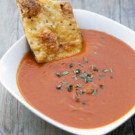 This tomato soup gets its unique flavor---slightly sweet, a little heat, super tasty---from some Moroccan-inspired ingredients. | www.spachethespatula.com #recipe