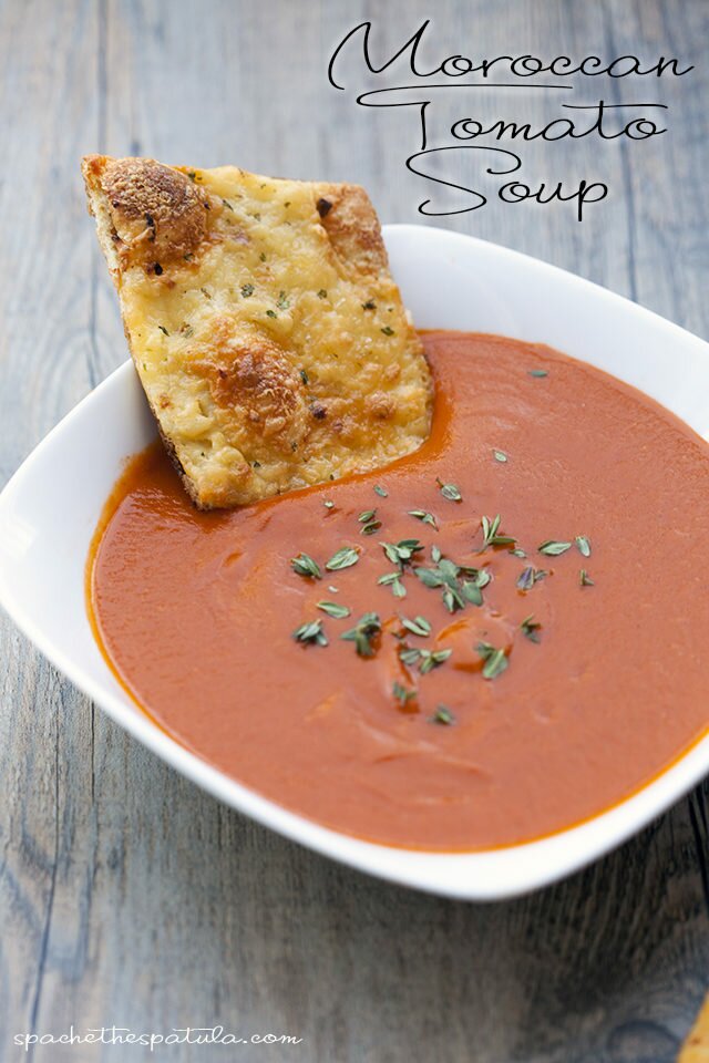 This tomato soup gets its unique flavor---slightly sweet, a little heat, super tasty---from some Moroccan-inspired ingredients. | www.spachethespatula.com #recipe