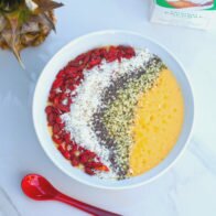 Tropical fruit and a nutrient-dense base make up this gorgeous smoothie bowl! #RootedinNutrition | www.spachethespatula.com #recipe #vegan