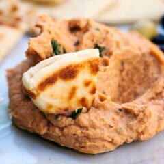 This hummus-like dip can be served warm or cold, and is packed with flavor from sun-dried tomatoes and thyme! | www.spachethespatula.com #recipe #vegan