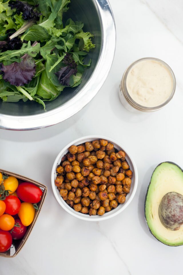 A crazy tasty #vegan caesar dressing, crunchy spiced chickpeas, creamy avocado, and sweet tomatoes make for an incredible lunch option! | www.spachethespatula.com #recipe