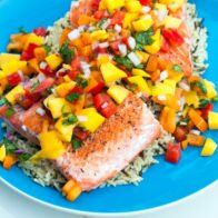 A fresh and vibrant mango salsa tops seared salmon fillets in the perfect Summer dish! | www.spachethespatula.com #recipe